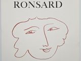 a white poster with a drawing of a woman ' s face on it