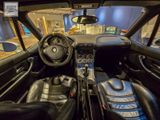 a view of the inside of a car from the driver ' s seat