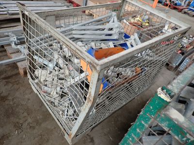 a metal cage filled with assorted items in a warehouse