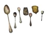 a lot of spoons and spoon spoons on a white surface