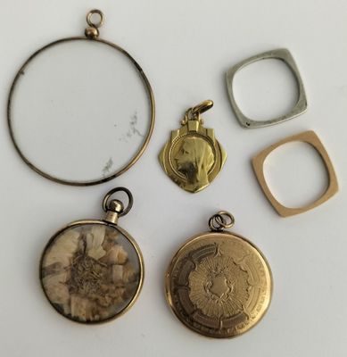three gold and silver lockes, one with a picture of a woman and one with a ring