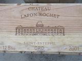 a wooden box with a picture of chateau lafon rochet on it