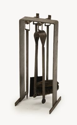 two forks and spoons in a metal holder