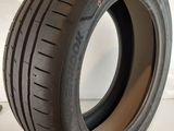 an image of a tire on a white surface next to a pair of pliers