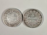 two silver coins with the names of france and france on them
