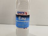 a bottle of eau water sitting on a table