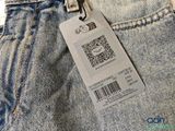 the back of a pair of jeans with a price tag on it