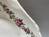 a white plate with a floral design on it