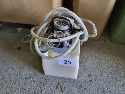 an image of a machine with a hose attached to it