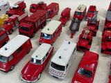 a lot of toy fire trucks that are on the table