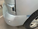 a close up of the front of a silver truck