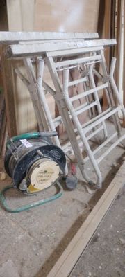 a picture of a ladder sitting on the floor in a room