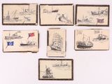 Plusieurs dessins de navires sont exposés sur une surface blanche