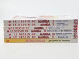several books stacked on top of each other on a white surface