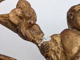 a gold statue of a man and a woman on a horse