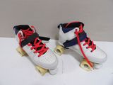 two pairs of roller skates with red and blue laces on them