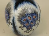 a blue and white vase sitting on a table
