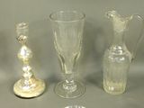 three glass vases sitting next to each other on a table