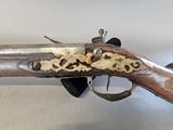 an old gun that is on display in a museum
