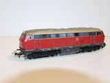 a toy train on a white table with a white background