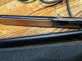 a flat iron sitting on top of a table next to a pair of scissors