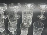 a lot of glasses that are sitting on a table