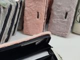 a purse that is sitting on a table next to other items
