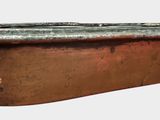 a rusted metal container with a handle on a white background