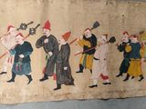 a painting on the wall of a building with people walking