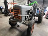 a tractor that is parked in a garage