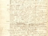 un vieux document sur lequel figurent des inscriptions, avec un stylo au milieu
