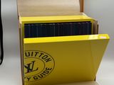 a yellow box that has a bunch of books inside of it