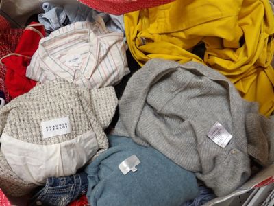 a suitcase full of clothes and clothes that are in it