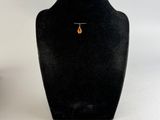 two black mannequins with a gold necklace on a white background