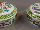 pair of chinese famille porcelain covered boxes with floral designs
