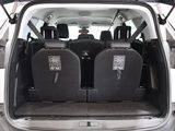 two seats in the back of a car with the doors open