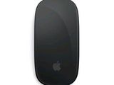 an apple mouse sitting on top of a white surface next to an adn logo