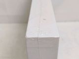 a close up of a piece of white paper on a table
