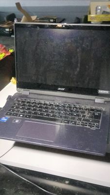 a laptop computer sitting on top of a white desk