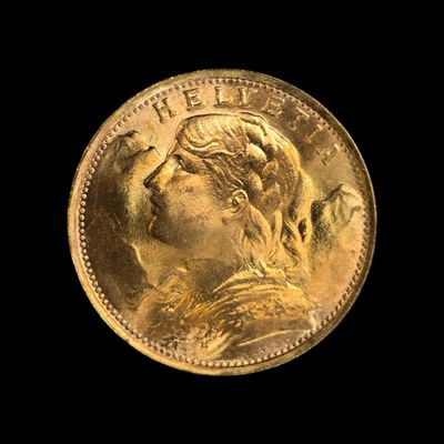 gros plan d'une pièce d'or portant un visage de femme