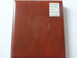brown leather album with a picture of a ship on the cover
