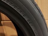 a close up of a tire with a box in the background
