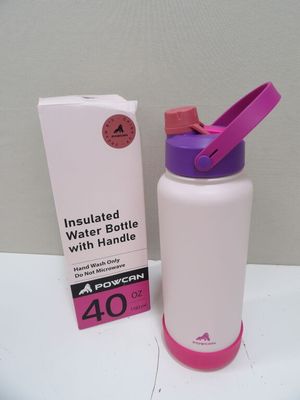 pink and white water bottle next to a box on a table