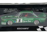 the box is black and white with a green car in it