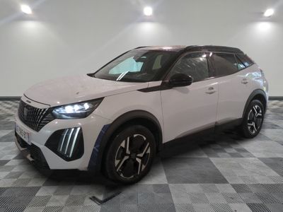 the white suv is parked on a checkered floor in a room