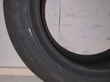 a close up of a tire on the floor in a room