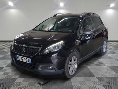 a picture of a black car parked in a garage