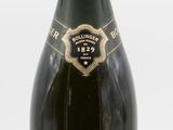bottles of champagne are lined up on a white surface