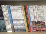 many books on a book shelf in a library