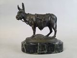 statue of a bull on a marble base on a white background
